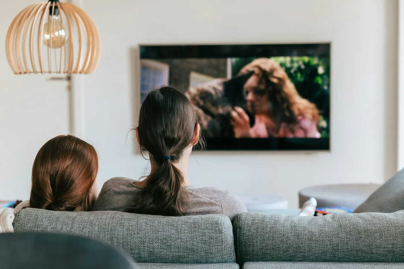 Two people enjoying television together at home